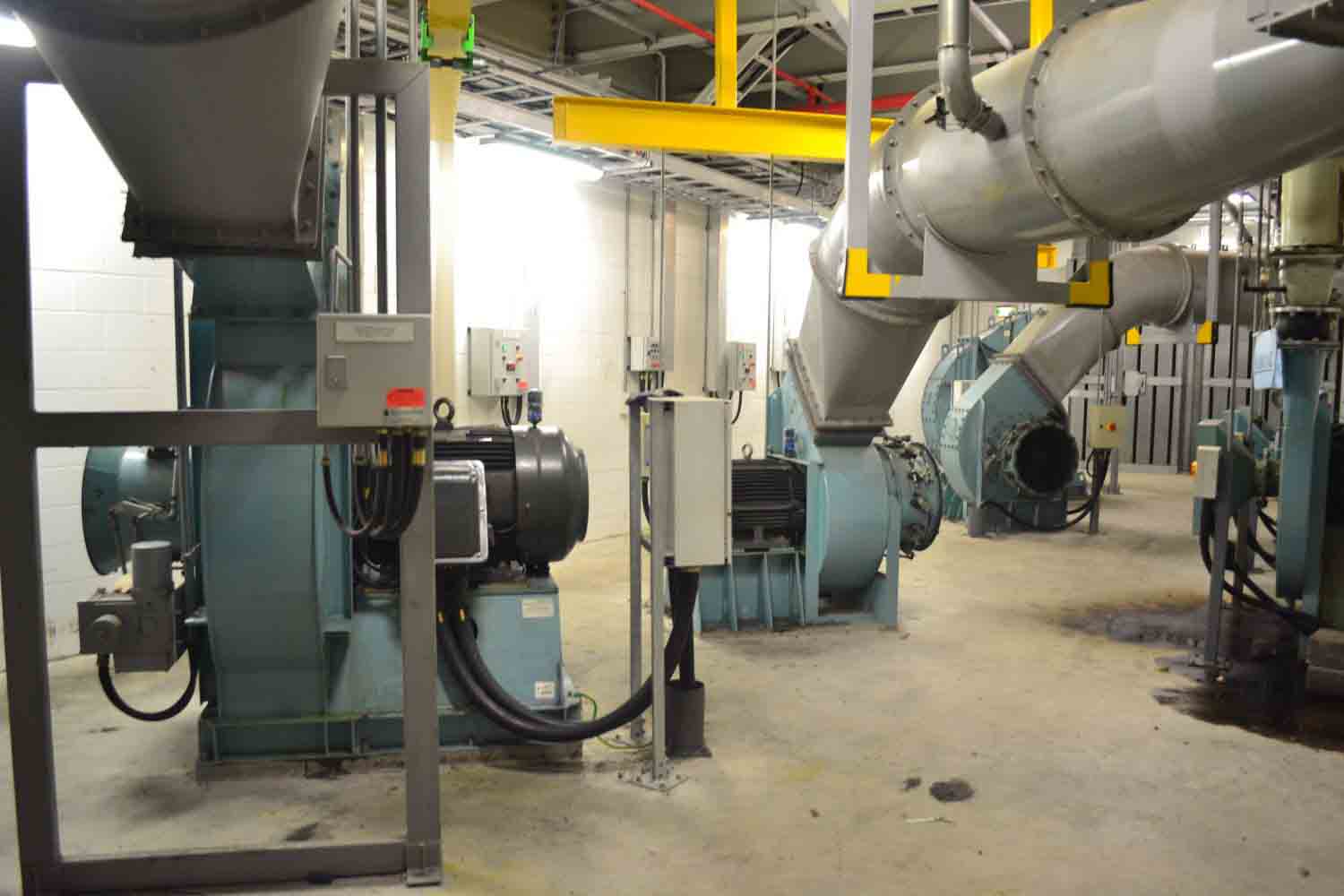 Industrial extraction fans and fabricated ducting inside a plant